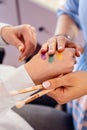 Closeup hands of professional female visagist applying colorful swatches of trendy eyeshadow Royalty Free Stock Photo