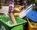 Closeup of hands separating plastic bottles