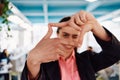 Closeup of hands, Smiling Business Woman Making Frame Gesture with at modern bright coworking open space startup office Royalty Free Stock Photo