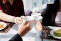 Closeup hands of team young business people in party celebrate success holding glass beverages cheer together. Royalty Free Stock Photo