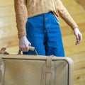 Closeup hands of travel woman holding big suitcase ready for business trip vacation. Fashion tourist woman preparing for Royalty Free Stock Photo