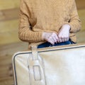 Closeup hands of travel woman holding big suitcase ready for business trip vacation. Fashion tourist woman preparing for Royalty Free Stock Photo