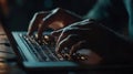 CloseUp Hands Typing on Backlit Laptop Keyboard in LowLight Work Environment Royalty Free Stock Photo