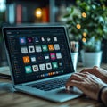 CloseUp of Hands Typing on a Laptop Keyboard, Displaying Management Interface at Workplace Royalty Free Stock Photo