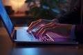 Closeup of hands typing on a laptop in a stylish