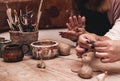Closeup of hands working on pottery wheel Royalty Free Stock Photo