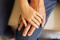 Closeup of hands of young child and old senior man, grandfather and granddaughter hands holding each other, family love and