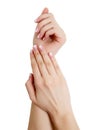 Closeup of hands of a young woman with long pink manicure on nails against white background Royalty Free Stock Photo