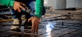 Closeup hands young worker using machine welding iron with hands working in industrial factory. Royalty Free Stock Photo