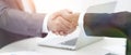 Closeup .handshake of business partners above the Desk Royalty Free Stock Photo