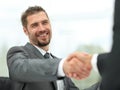 Closeup .handshake of business partners on a Desk