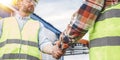 Closeup handshake of group engineers on produce site