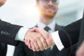 Closeup handshake proven business partners