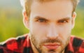 Closeup of handsome man portrait. Bearded hipster, serious emotions, gay guy.