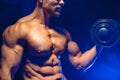 Closeup of a handsome power athletic man bodybuilder doing exercises with dumbbell Royalty Free Stock Photo