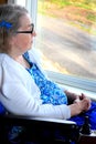 Closeup Handicapped woman sitting by window