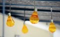 Hanging orange party bulbs Royalty Free Stock Photo