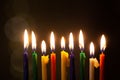 Closeup of Hanukkah menorah, or hanukkiah for Jewish holiday Hanukkah. Nine colored candles.