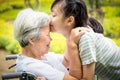 Closeup,Happy asian elderly woman with beautiful child girl hugging,kissing,smiling in summer,love of granddaughter with senior