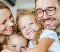 Closeup of a happy Caucasian family of four relaxing in the living room at home. Loving smiling family being Royalty Free Stock Photo