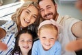 Closeup of happy caucasian family taking selfies at home. Loving parents capturing photos and pictures for special