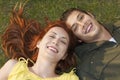 Closeup Of Happy Couple Lying On Grass Royalty Free Stock Photo
