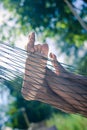 Closeup of happy family lying on hammock on sunny countryside background.