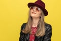 Closeup of happy fashion model smiling, wearing hat and sunglasses