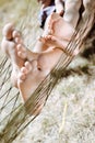 Closeup of happy father and child barefoot feet in