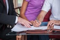 Closeup on happy man hand signing agreement on new house. Royalty Free Stock Photo