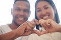 Closeup of happy mixed race couple forming heart shape with hands. Two lovers showing heart sign by hands together Royalty Free Stock Photo