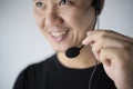 Closeup of happy telephone operators. Service desk consultant talking on hands-free phone Royalty Free Stock Photo