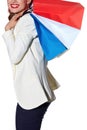 Closeup on happy woman with French flag colours shopping bags Royalty Free Stock Photo