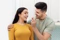 Closeup of happy young romantic couple having fun while cooking Royalty Free Stock Photo