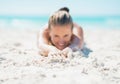 Closeup on happy young woman laying on beach