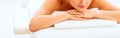 Closeup on young woman laying on massage table Royalty Free Stock Photo