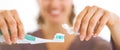 Closeup on young woman squeezing toothpaste from tube Royalty Free Stock Photo