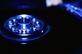 Closeup hard disk detail on blue background Royalty Free Stock Photo