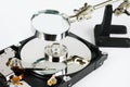 Closeup - hard disk repair and magnifying glass