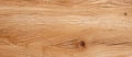Closeup of hardwood plank with brown grain pattern and varnish Royalty Free Stock Photo