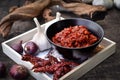 Closeup of Harissa served in a bowl with garlic and hot chili pepper Royalty Free Stock Photo