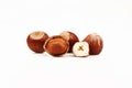 Organic and fresh shelled groats and half hazelnuts on white background Royalty Free Stock Photo