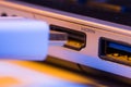 Closeup of HDMI cable plug inserted into port on the side of a l Royalty Free Stock Photo