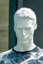 closeup head of a male mannequin in a t-shirt in a large shopping Royalty Free Stock Photo