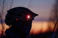 closeup of headlamp on helmet during twilight