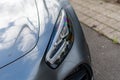 Closeup of headlight of gray Mercedes