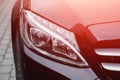 Closeup headlight luxury sedan car