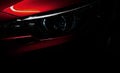 Closeup headlight of shiny red luxury SUV compact car. Elegant electric car technology and business concept. Hybrid auto Royalty Free Stock Photo