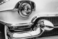 Closeup of the headlights and front bumper on vintage automobile