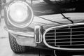 Closeup of the headlights and front bumper on vintage automobile Royalty Free Stock Photo